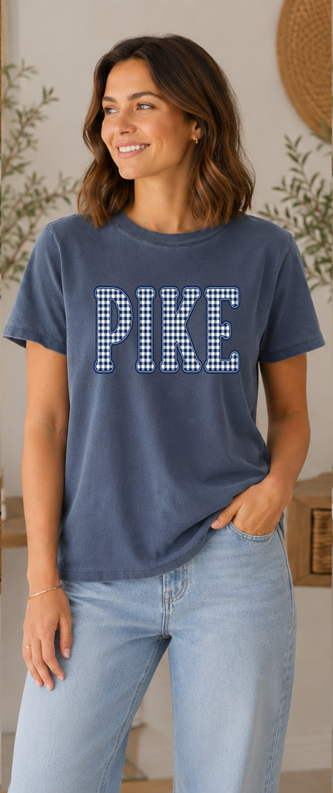 Woman wearing a washed navy t-shirt with a navy gingham PIKE design