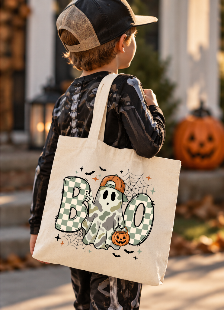 Green and white checkered BOO with camo ghost, backwards orange cap with pumpkin bucket. Bats and spider web also visible