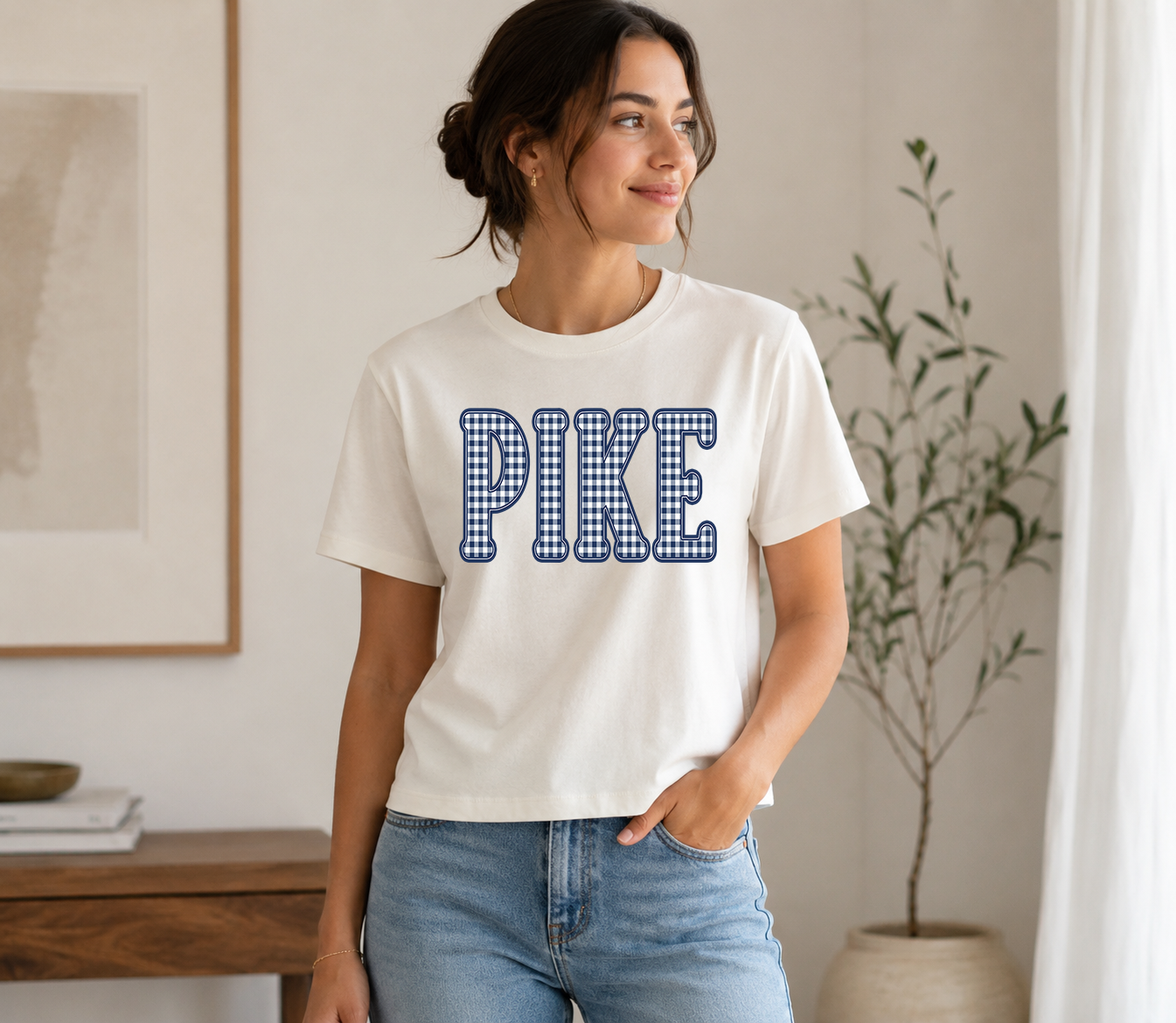 Woman wearing a vintage white t-shirt with a navy gingham PIKE design