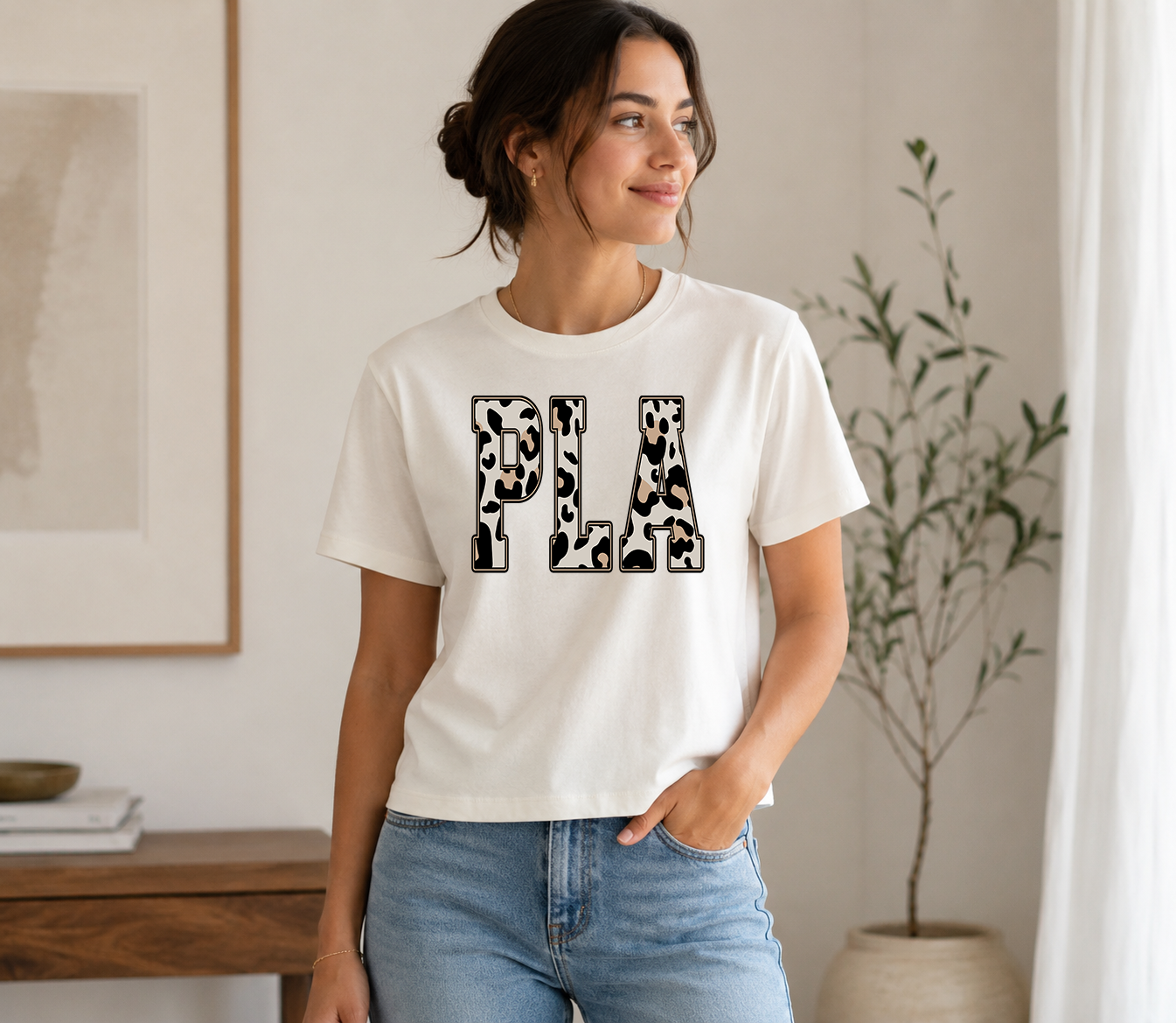 Boutique-style unisex t-shirt featuring personalized school initials in a trendy neutral leopard print. Custom school spirit tee available in multiple school designs and shirt colors for students, parents, teachers, alumni, and game day.
